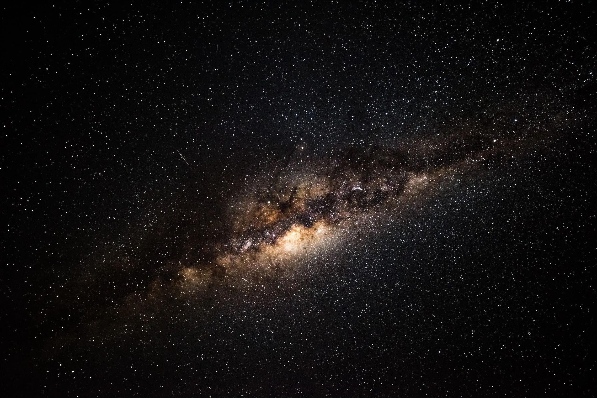 The Milky Way galaxy across a dark, star-filled night sky
